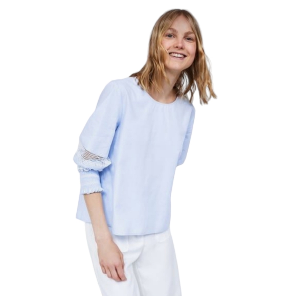 ZARA small blue cotton blouse with white floral lace cutouts and bow on Back